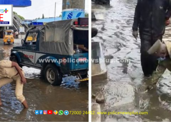 கால்வாய் அடைப்பினை சரி செய்த காவல்துறையினர்