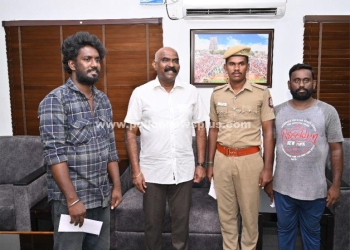 காரில் சிக்கிய இருவரை காப்பாற்றிய காவலர்